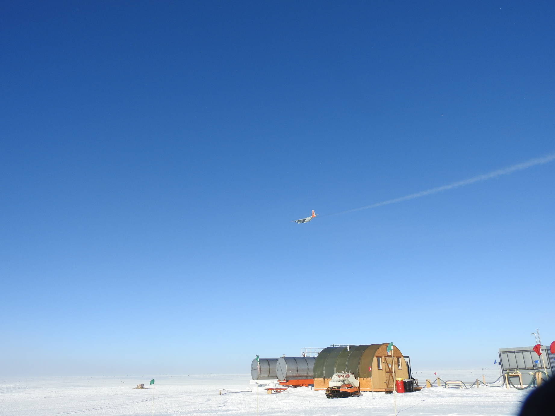 The final aircraft flying over the station saying goodbye. (Courtesy NSF/James Casey).