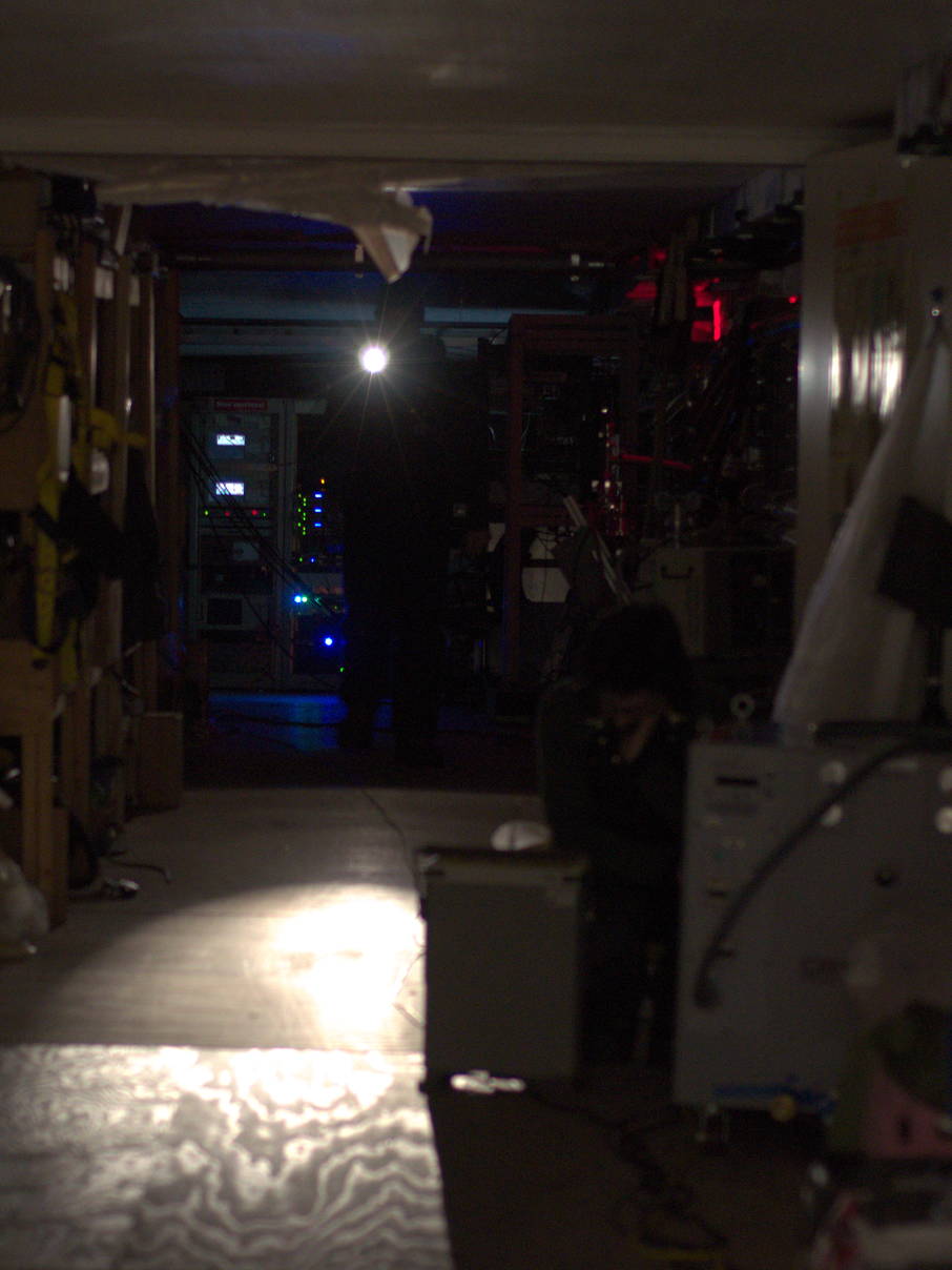 Me walking through the dark telescope building. The power was intentionally cut to test noise properties of the telescope.