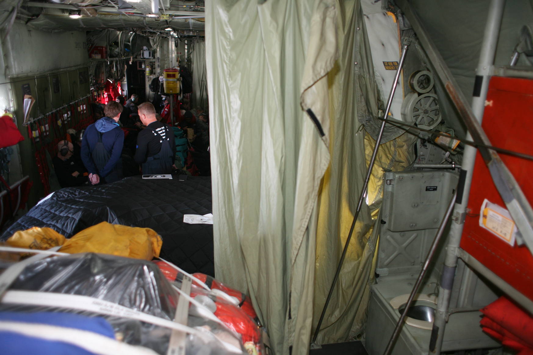 Toilets are located behind curtains. Luckily it's loud enough that noone can hear a thing.