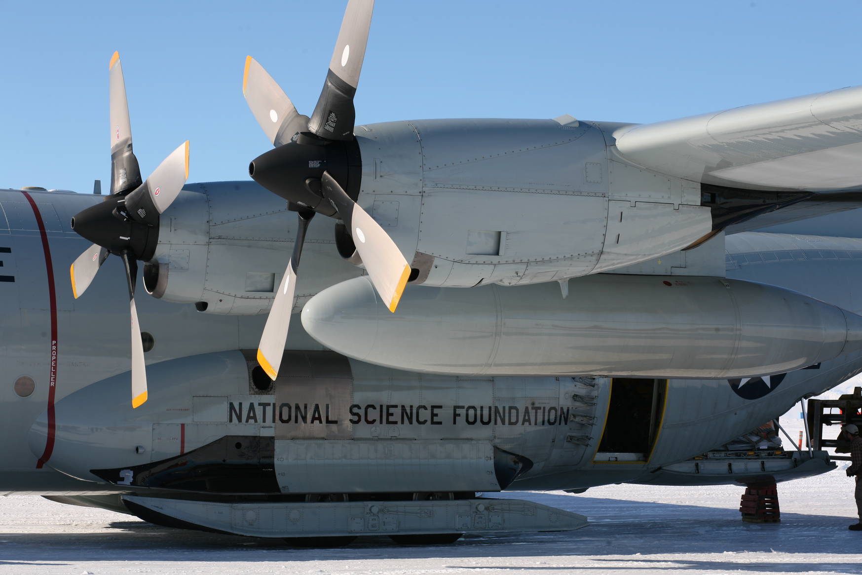 In order to land on a snow runway the aircraft is equipped with giant skis.