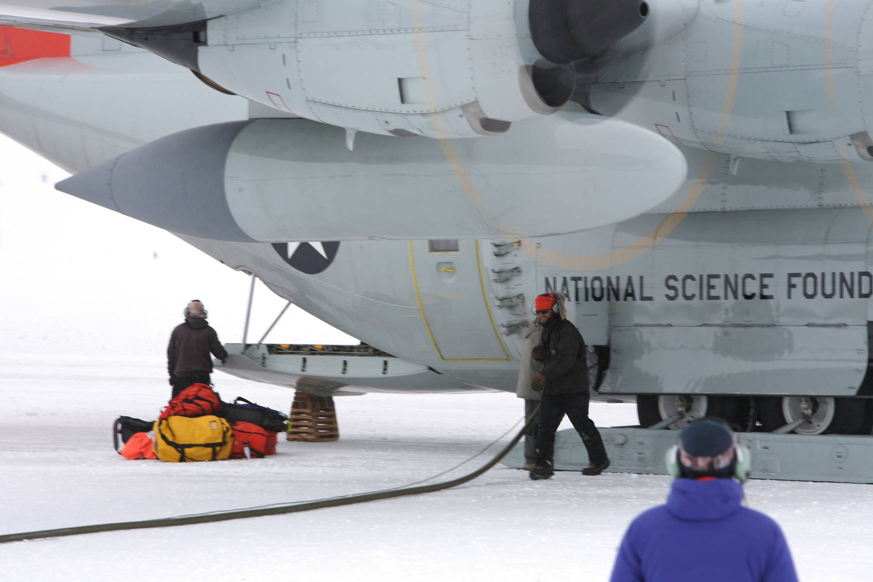 Fuel handling, just three meters from the running propellers.