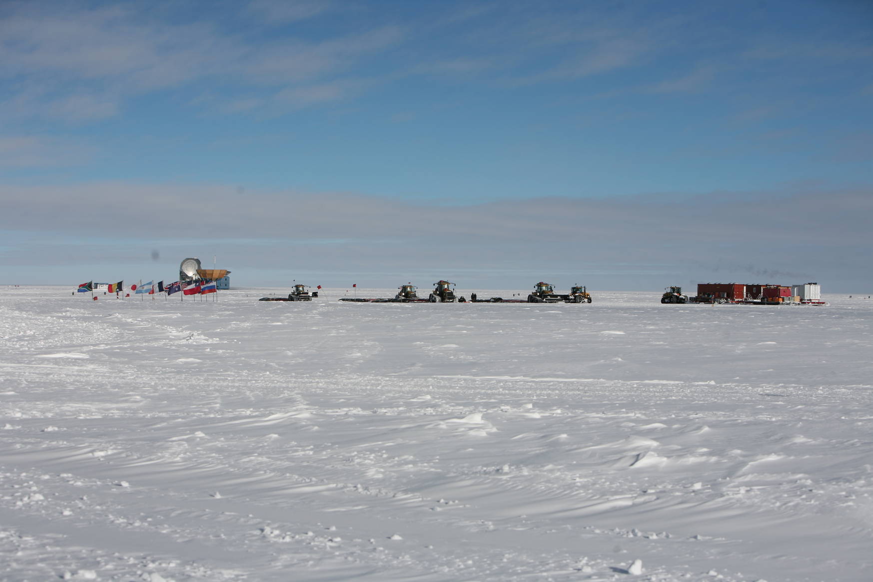 They might seem small, but they ain't. These tractors are huge and each one is pulling around 90000 liters of jetfuel for the station.