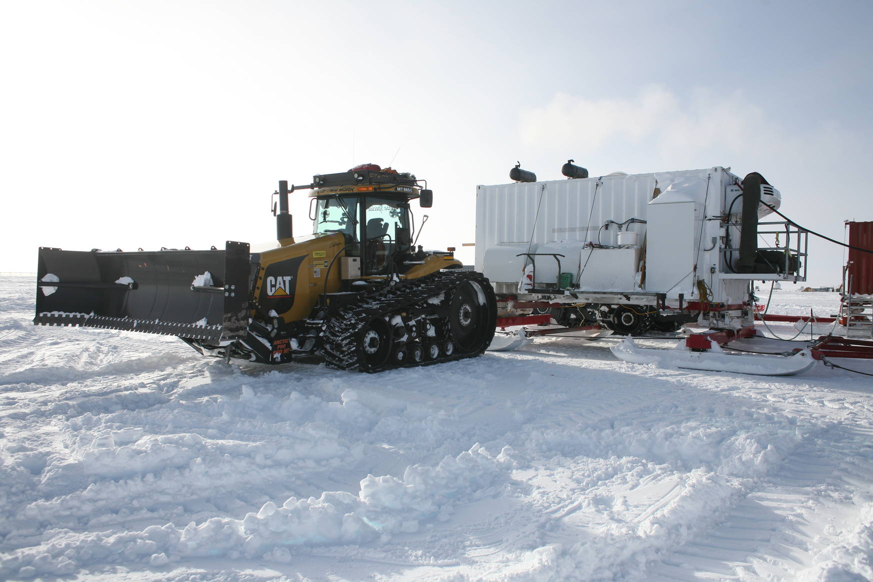 Another tractor. The white container in the background holds the generators for power and heat along the trail.